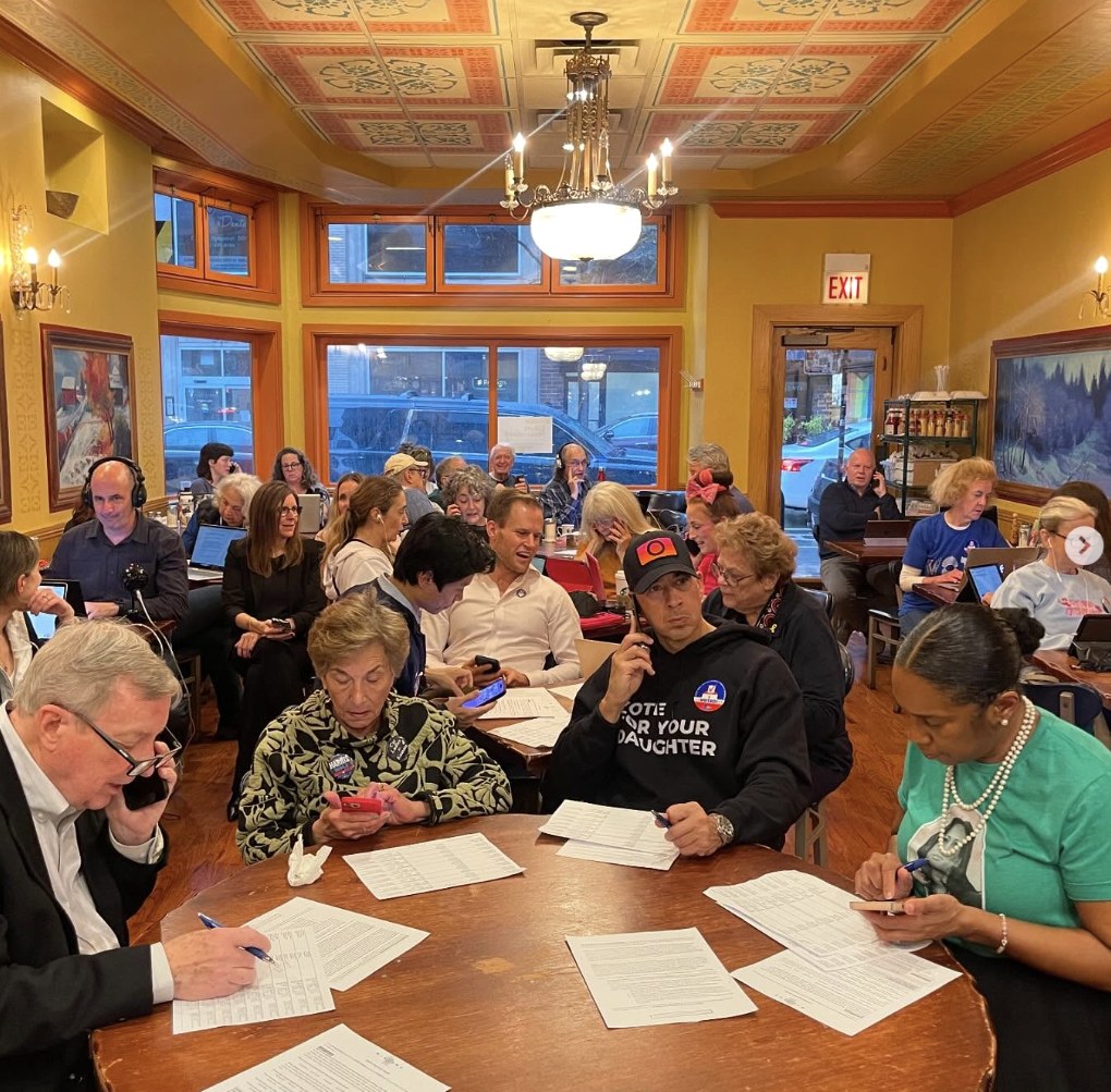 Volunteers making calls to swing-state voters at a phonebank